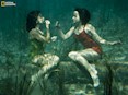 J. BAYLOR ROBERTS (1944) A pair of performers put on lipstick underwater at Wakulla Springs near Tallahassee, Florida. National Geographic exhibition "WOMEN.”