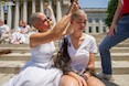 AMI VITALE (2012) On the steps of the West Virginia State Capitol, a woman gets her head shaved symbolic of mountaintop removal and the many people who are sick or dying as the result.  National Geographic exhibition "WOMEN.”